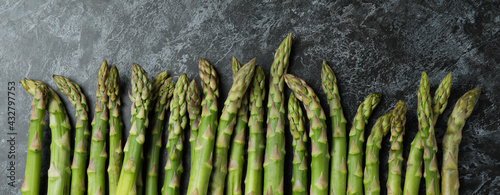 Fresh green asparagus on black smokey background