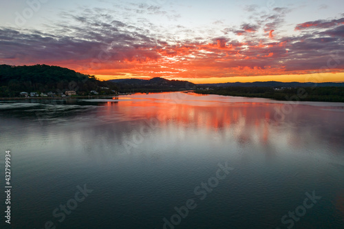 Sunrise aerial waterscape with clouds