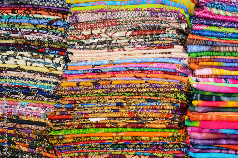 Balinese batik sarong are readily available at art markets, shops or tourist attractions / Batik Sarong background / Beautiful and affordable, simple to tie, easily matched to your wardrobe Balinese batik sarong are readily available at art markets, shops or tourist attractions / Batik Sarong background / Beautiful and affordable, simple to tie, easily matched to your wardrobe