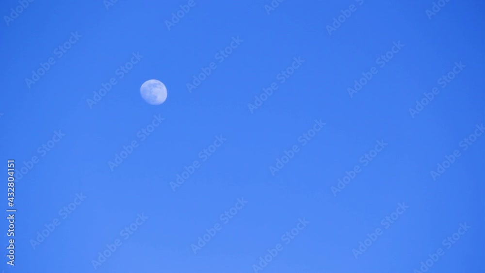Blue moon in the daytime sky. Moon at noon Blue moon in the daytime sky. Moon at noon