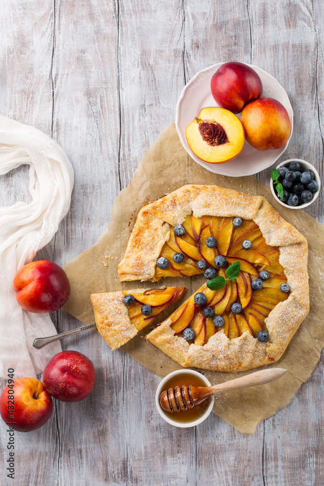 Homemade pie with peaches, ricotta and fresh blueberries