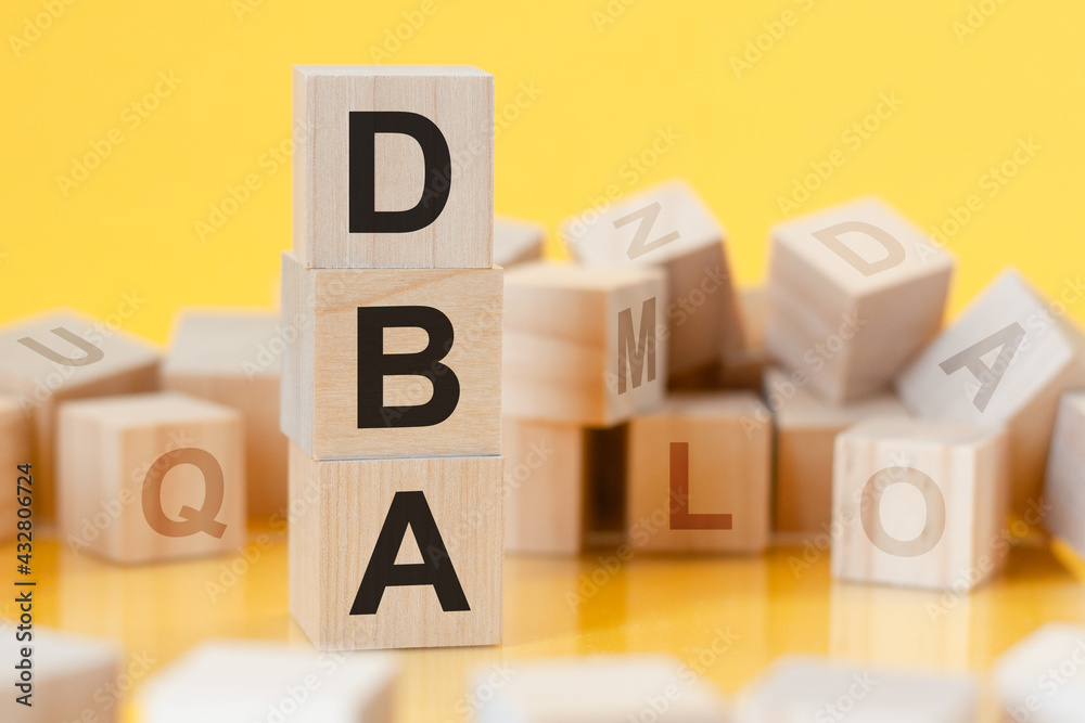 word dba from wooden blocks with letters, concept word dba from wooden blocks with letters, concept