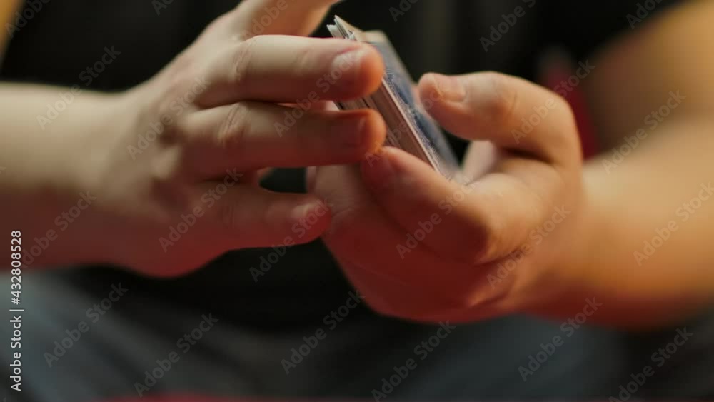Slow motion closeup of hands shuffling a deck of cards. Slow motion closeup of hands shuffling a deck of cards.