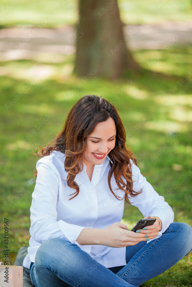 Young happy woman texting in the messenger. Quarantine. Young happy woman texting in the messenger. Quarantine.