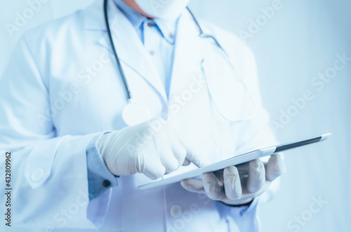 Healthcare And Medicine.  Medical and technology. Doctor working on digital tablet on white background.