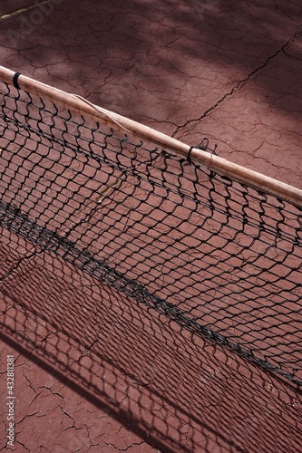 old abandoned tennis court, sports equipment