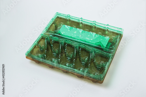 Plastic container for eggs on a white background. Chicken Egg Storage Container