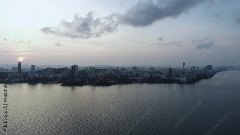 Flying over a calm sea at Jomtien Pattaya City Thailand during a sunrise Flying over a calm sea at Jomtien Pattaya City Thailand during a sunrise