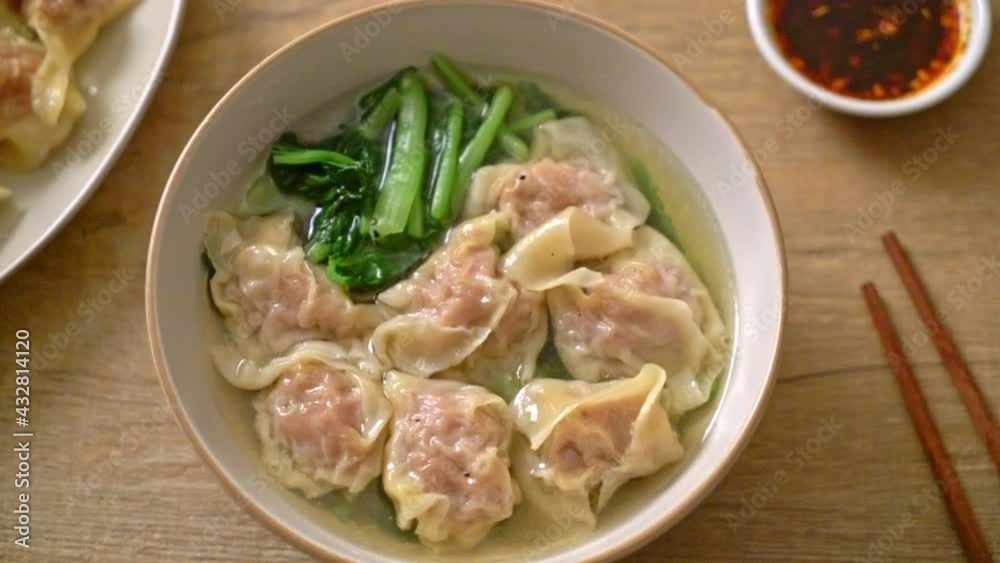 pork wonton soup or pork dumplings soup with vegetable - Asian food style pork wonton soup or pork dumplings soup with vegetable - Asian food style