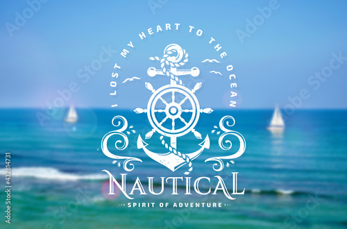 Nautical emblem with anchor and steering wheel on blurred background.
