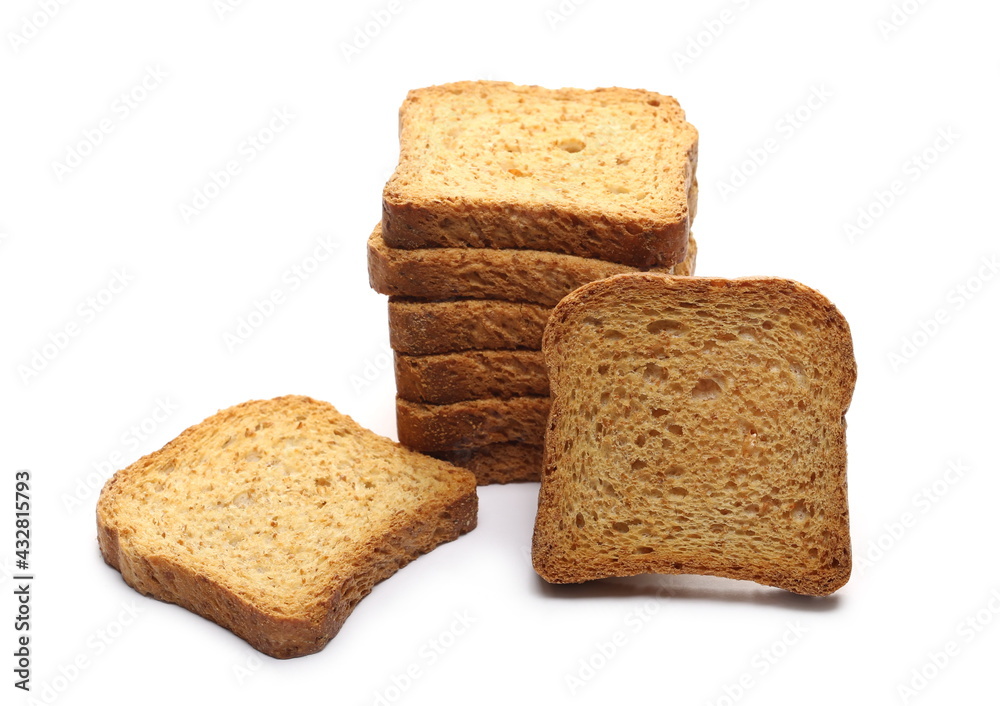 Wholemeal crackers, bread rusks pile, toast slices isolated on white background Wholemeal crackers, bread rusks pile, toast slices isolated on white background