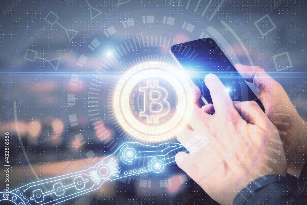 Double exposure of man's hands holding and using a phone and crypto currency blockchain theme drawing. Double exposure of man's hands holding and using a phone and crypto currency blockchain theme drawing.