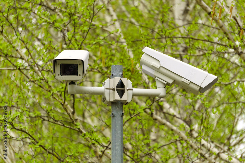 Installation of video surveillance on poles to check the security of the entrance and exit. Selective Focus Installation of video surveillance on poles to check the security of the entrance and exit. Selective Focus