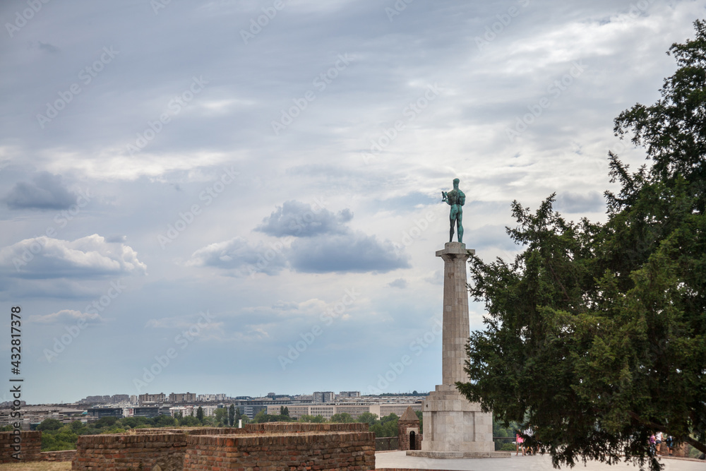  Victor statue on Kalemegdan fortress, during a cloudy afternoon in Belgrade, Serbia. Also called Viktor Pobednik, Located in Kalemegdan fortress, it's a landmark of the city...