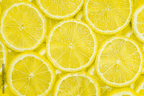fresh lemon sliced into slices. lemon background