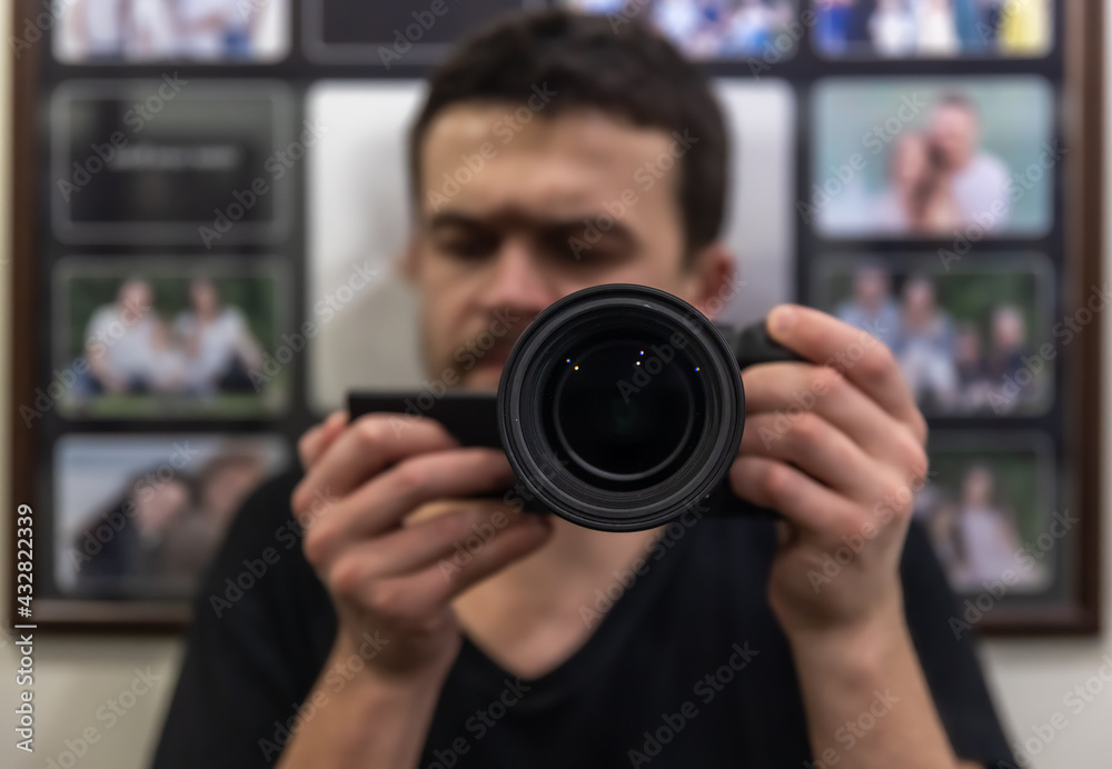 Close-up lens in the hands of a man on a blurred background. Close-up lens in the hands of a man on a blurred background.