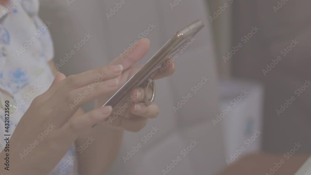 Asian woman working with her smartphone. trading bitcoin. online shoping. Social media. Asian woman working with her smartphone. trading bitcoin. online shoping. Social media.
