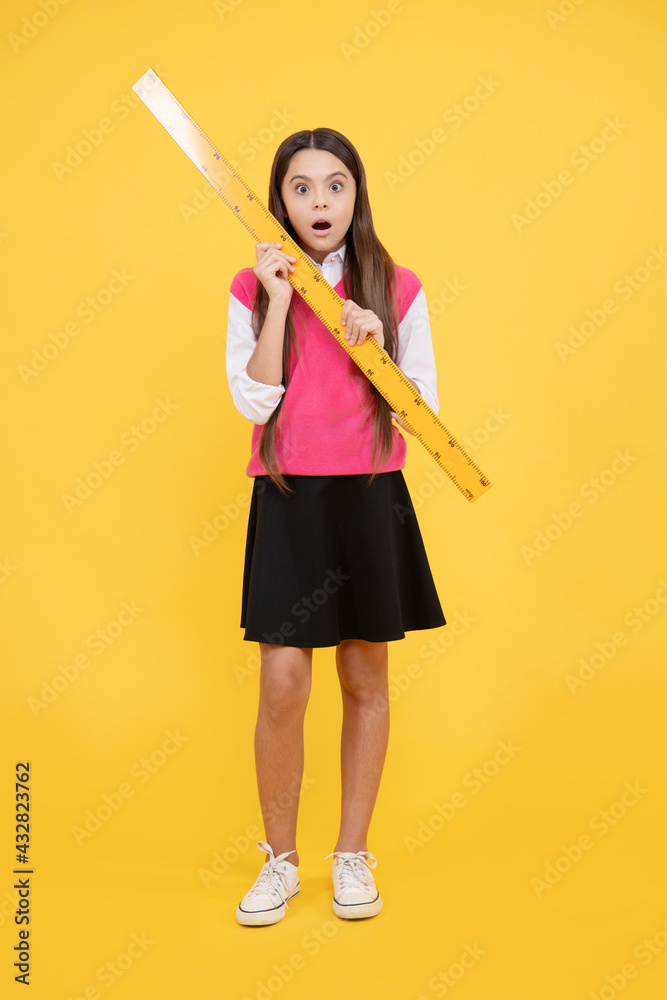 surprised teen girl study math with ruler measuring size, back to school surprised teen girl study math with ruler measuring size, back to school