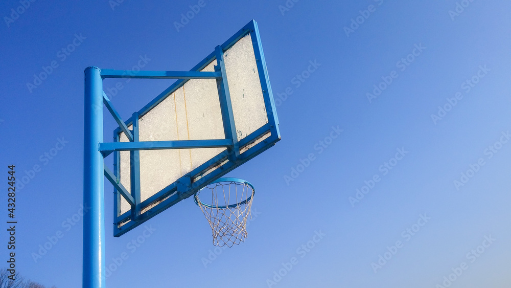 basketball hoop on blue sky