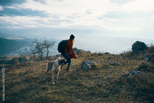 woman hiker with dog on nature travel mountains landscape fun © SHOTPRIME STUDIO
