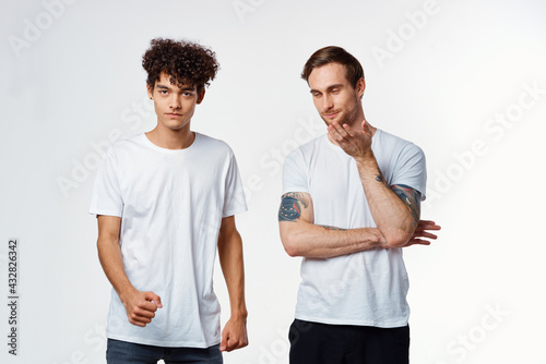 two friends in white t-shirts communication fun positive