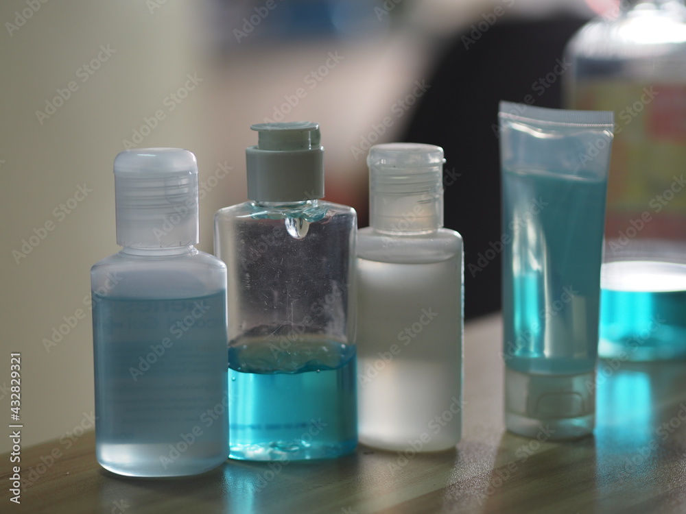 Hand Sanitizer, gel alcoholic mixture with gelatin in clear Plastic bottle with pump pushing prevent germs protect Contagious disease coronavirus covid-19, on the table blurred background Hand Sanitizer, gel alcoholic mixture with gelatin in clear Plastic bottle with pump pushing prevent germs protect Contagious disease coronavirus covid-19, on the table blurred background