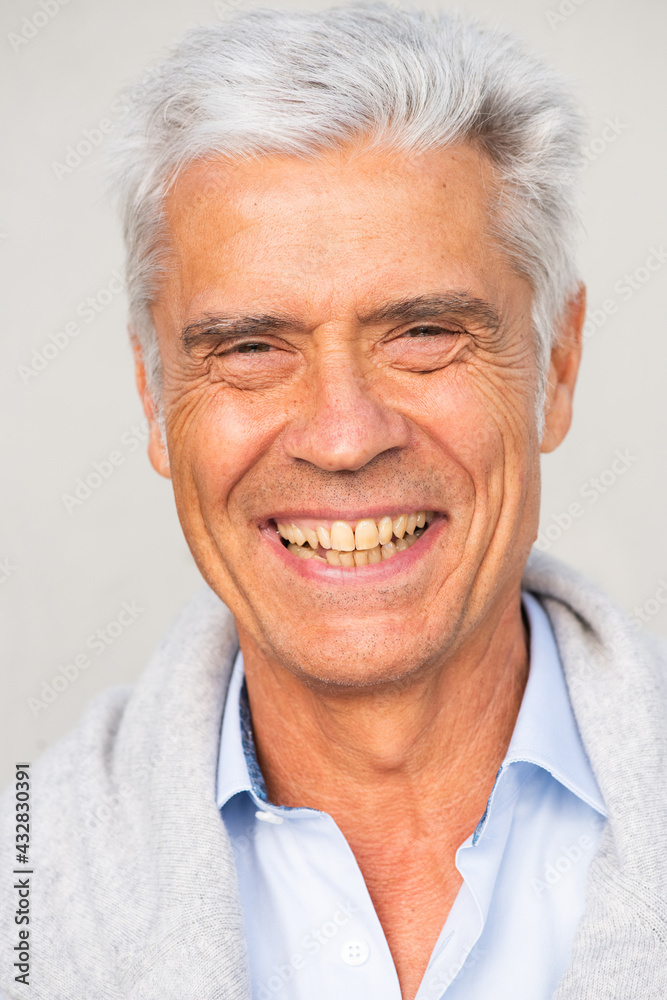 headshot smiling older man against white background headshot smiling older man against white background