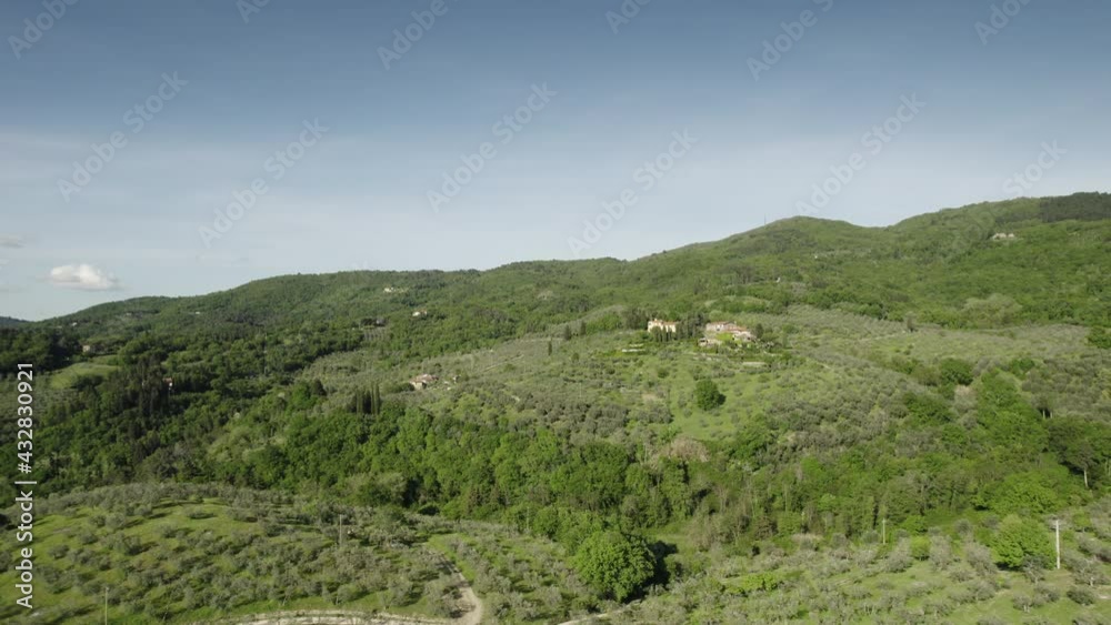 Aerial view above the tuscan countryside with forest and olive trees in Chianti region. Italy. Aerial view above the tuscan countryside with forest and olive trees in Chianti region. Italy.