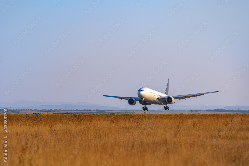 Passenger plane takes off from runway in airport Passenger plane takes off from runway in airport