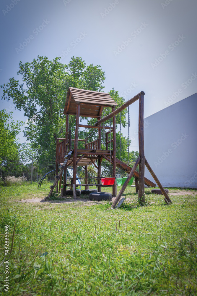 Fototapeta premium playground for kids simulating square games at the bottom of a garden