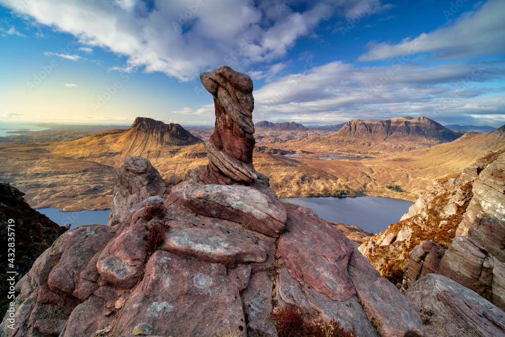 View of the Assynt Landscape with Sandstone stack in foreground. taken from Sgorr Tuath mountain.