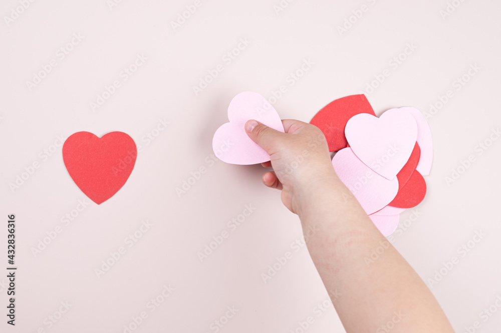 A child holding a heart in his hand A child holding a heart in his hand