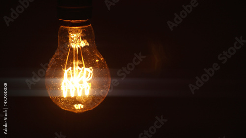 Fotografi Vintage Edison light bulb reproduction.
