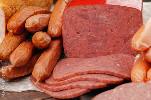 Variety of meat and sausage products on table