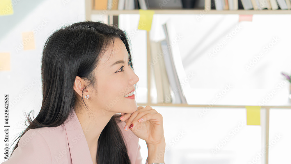 Young business woman working on financial graph analysis on desk with laptop and calculator. Young business woman working on financial graph analysis on desk with laptop and calculator.