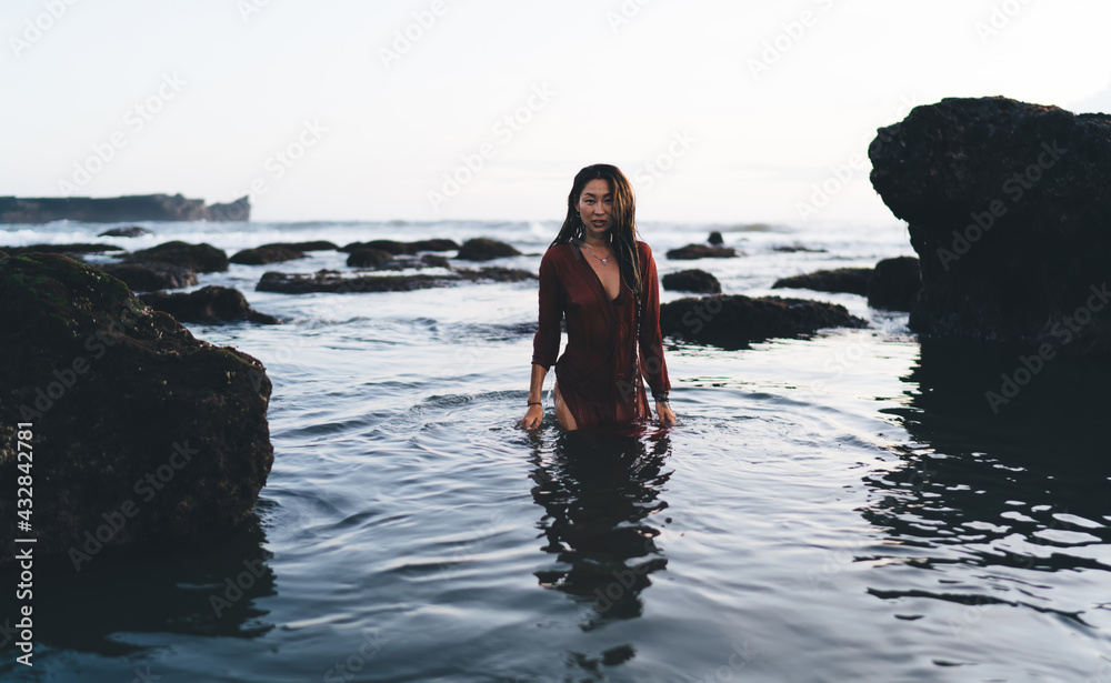 Fit lady standing in water
