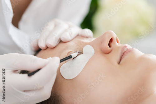 Lashes treated professionally in salon © Kzenon