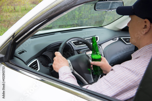 An alcoholic driving a car © fotopai