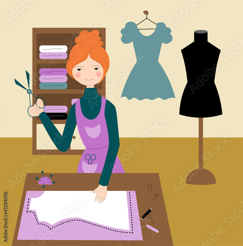Seamstress cutting a dress in an atelier