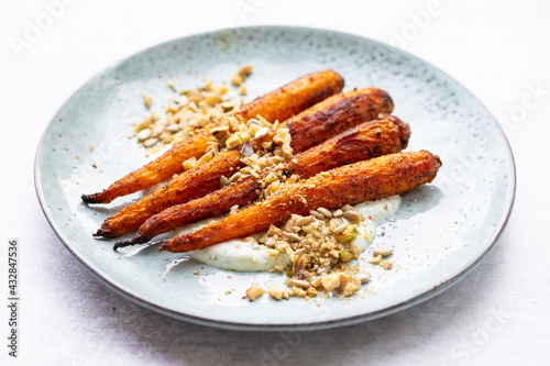 Cumin spiced roast carrots with dukkah and garlic sauce