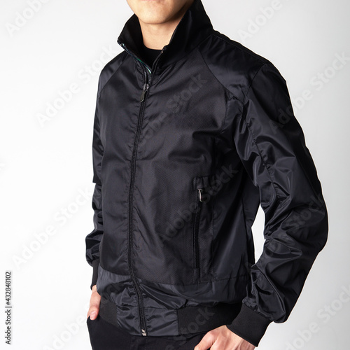 black men's windbreaker jacket on model on white background