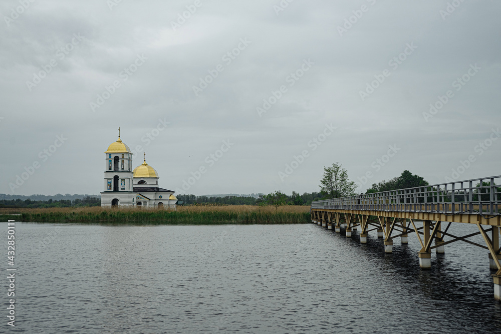 Classic orthodox village church with natural rainy background