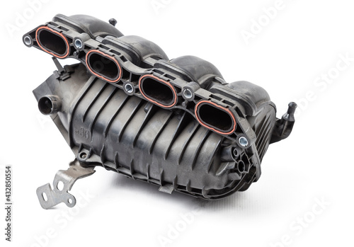 Intake manifold plastic housing with a system for adjusting the air flow to the engine. Repair and replacement of spare parts of vehicles in a car service. photo