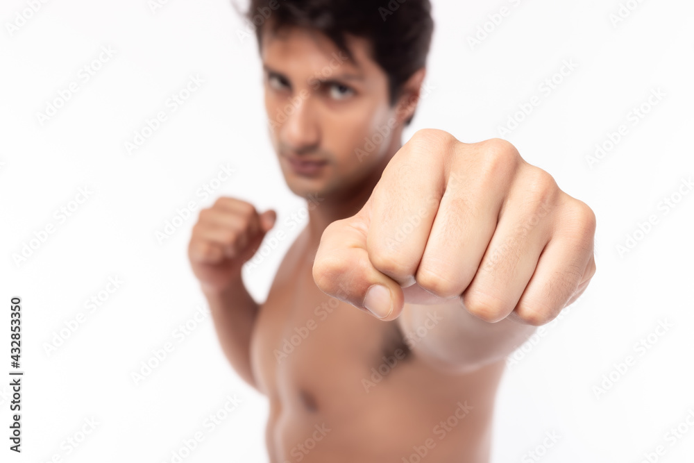 Tough Boxer guy showing punch fist isolated on white background Handsome young fighter men punching in studio shot with determined and powerful Sportsman get strong Fitness man exercising Bare chest Tough Boxer guy showing punch fist isolated on white background Handsome young fighter men punching in studio shot with determined and powerful Sportsman get strong Fitness man exercising Bare chest