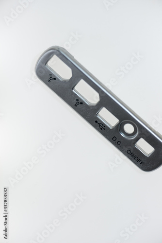 backplate of a external hard drive enclosure, isolated on white, photographed with a macro lens (shallow depth of field) - featuring firewire 400 and USB connector