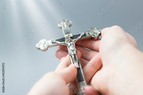 Fotografija Christian cross held in hands