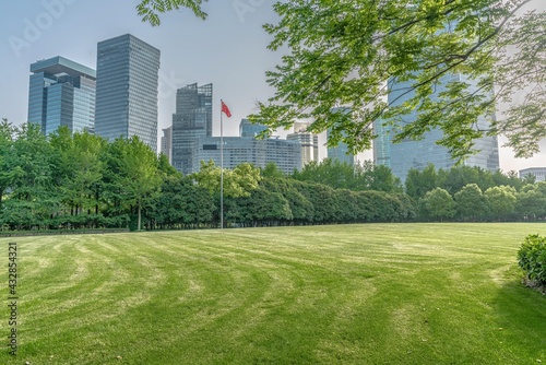 Lujiazui central park, green grass and modern skycrapers, for background.