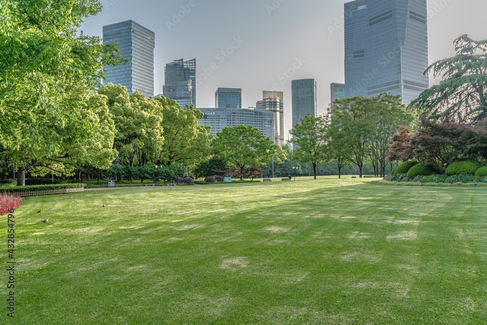Lujiazui central park, green grass and modern skycrapers, for background. Lujiazui central park, green grass and modern skycrapers, for background.