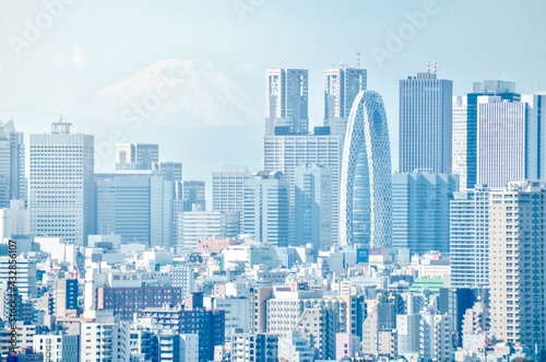 Landscape of skyscraper building with Fuji mountain among the fog in Tokyo area in winter time