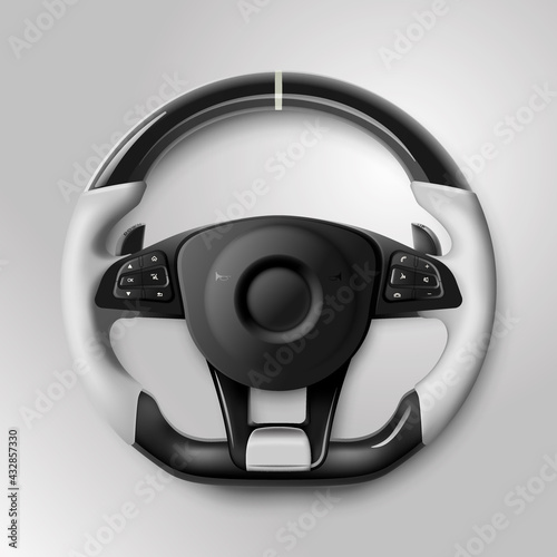 Expensive black and white car rudder with buttons and leather braiding